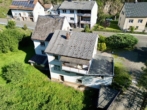 Schnäppchenjäger aufgepasst! Freistehendes Zweifamilienhaus im Herzen von Fischbach - Außenansicht I